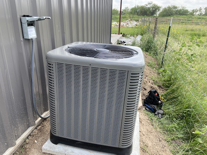 Newly installed AC condenser unit at a Mission, TX property by Climate Heating & Cooling